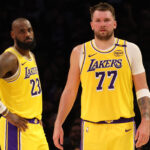 LeBron Luka Feb 19, 2025; Los Angeles, California, USA; Los Angeles Lakers forward LeBron James (23) and guard Luka Doncic (77) during the second quarter against the Charlotte Hornets at Crypto.com Arena.