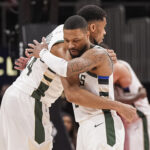 Mar 4, 2025; Atlanta, Georgia, USA; Milwaukee Bucks forward Giannis Antetokounmpo (34) and guard Damian Lillard (0) react after defeating the Atlanta Hawks at State Farm Arena.