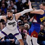 Mar 5, 2025; Denver, Colorado, USA; Sacramento Kings center Jonas Valanciunas (17) and Denver Nuggets center Nikola Jokic (15) battle for position in the second quarter at Ball Arena. Mandatory Credit: Isaiah J. Downing-Imagn Images