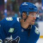 Mar 18, 2025; Vancouver, British Columbia, CAN; Vancouver Canucks forward Dakota Joshua (81) skates during warm up prior to a game against the Winnipeg Jets at Rogers Arena. Mandatory Credit: Bob Frid-Imagn Images