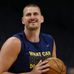 Apr 11, 2025; Denver, Colorado, USA; Denver Nuggets center Nikola Jokic (15) reacts before the game against the Memphis Grizzlies at Ball Arena.