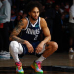 Apr 18, 2025; Memphis, Tennessee, USA; Dallas Mavericks center Dereck Lively II (2) stretches prior to the game against the Memphis Grizzlies at FedExForum.