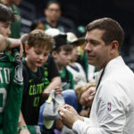 Apr 23, 2025; Boston, Massachusetts, USA; Brad Stevens, president of basketball operations signs autographs before game 2 of first round of the 2024 NBA Playoffs against the Orlando Magic at TD Garden.