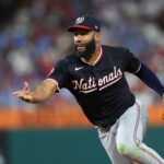 Apr 30, 2025; Philadelphia, Pennsylvania, USA; Washington Nationals third base Amed Rosario (13) tosses the ball to first for an out to end the sixth inning against the Philadelphia Phillies at Citizens Bank Park. Mandatory Credit: Bill Streicher-Imagn Images