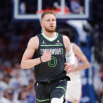 May 20, 2025; Oklahoma City, Oklahoma, USA; Minnesota Timberwolves guard Donte DiVincenzo (0) runs down the court against the Oklahoma City Thunder in the fourth quarter during game one of the western conference finals for the 2025 NBA Playoffs at Paycom Center.