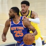 May 31, 2025; Indianapolis, Indiana, USA; New York Knicks forward Mikal Bridges (25) dribbles the ball defended by New York Knicks guard Delon Wright (0) in the first quarter during game six of the eastern conference finals for the 2025 NBA Playoffs at Gainbridge Fieldhouse. Mandatory Credit: Trevor Ruszkowski-Imagn Images