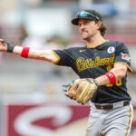 Jun 1, 2025; San Diego, California, USA; Pittsburgh Pirates second baseman Adam Frazier (26) makes the throw to first for an out during the fifth inning against the San Diego Padres at Petco Park. Mandatory Credit: David Frerker-Imagn Images