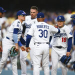 Jun 1, 2025; Los Angeles, California, USA; Los Angeles Dodgers manager Dave Roberts (30) relieves starting pitcher Yoshinobu Yamamoto (18) at the mount with second baseman Enrique Hernandez (8), first baseman Freddie Freeman (5), shortstop Miguel Rojas (72), and catcher Will Smith (16) against the New York Yankees during the fourth inning at Dodger Stadium. Mandatory Credit: Jonathan Hui-Imagn Images