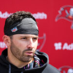Jun 10, 2025; Tampa Bay, FL, USA; Tampa Bay Buccaneers quarterback Baker Mayfield (6) gives a press conference after mini camp at AdventHealth Training Center. Mandatory Credit: Nathan Ray Seebeck-Imagn Images