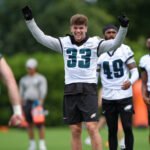 Jun 10, 2025; Philadelphia, PA, USA; Philadelphia Eagles defensive back Cooper DeJean (33) reacts during warmups before a practice drill at NovaCare Complex. Mandatory Credit: Kyle Ross-Imagn Images