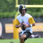 Jun 10, 2025; Pittsburgh, PA, USA; Pittsburgh Steelers quarterback Aaron Rodgers (8) drops back to pass during minicamp at their South Side facility.