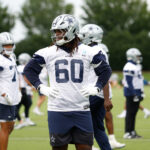 Jun 10, 2025; Arlington, TX, USA; Dallas Cowboys offensive tackle Tyler Guyton (60) goes through a drill during practice at the Ford Center at the Star Training Facility in Frisco, Texas.