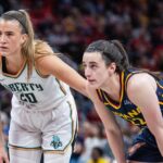 Jun 14, 2025; Indianapolis, Indiana, USA; New York Liberty guard Sabrina Ionescu (20) and Indiana Fever guard Caitlin Clark (22) in the second half at Gainbridge Fieldhouse. Mandatory Credit: Trevor Ruszkowski-Imagn Images