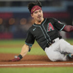 Jun 18, 2025; Toronto, Ontario, CAN; Arizona Diamondbacks right fielder Corbin Carroll (7) slides into third base on his triple against the Toronto Blue Jays during the sixth inning at Rogers Centre. Mandatory Credit: John E. Sokolowski-Imagn Images