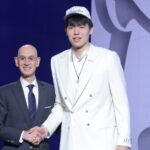 Jun 25, 2025; Brooklyn, NY, USA; Yang Hansen stands with NBA commissioner Adam Silver after being selected as the 16th pick by the Memphis Grizzlies in the first round of the 2025 NBA Draft at Barclays Center. Mandatory Credit: Brad Penner-Imagn Images