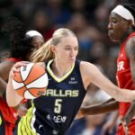Jun 27, 2025; Dallas, Texas, USA; Dallas Wings guard Paige Bueckers (5) and Indiana Fever forward Natasha Howard (6) in action during the game between the Dallas Wings and the Indiana Fever at the American Airlines Center. Mandatory Credit: Jerome Miron-Imagn Images