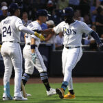 Jun 30, 2025; Tampa, Florida, USA; Tampa Bay Rays third base Junior Caminero (13) is congratulated after he hit a two-run home run against the Athletics during the fourth inning at George M. Steinbrenner Field. Mandatory Credit: Kim Klement Neitzel-Imagn Images