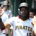 Jul 2, 2025; Pittsburgh, Pennsylvania, USA; Pittsburgh Pirates center fielder Oneil Cruz (15) celebrates in the dugout after scoring a run against he St. Louis Cardinals during the second inning at PNC Park. Mandatory Credit: Charles LeClaire-Imagn Images
