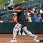 Jul 5, 2025; West Sacramento, California, USA; San Francisco Giants designated hitter Rafael Devers (16) catches a throw at first base before the game against the Athletics at Sutter Health Park. Mandatory Credit: Darren Yamashita-Imagn Images