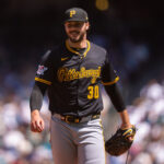 Jul 6, 2025; Seattle, Washington, USA; Pittsburgh Pirates starting pitcher Paul Skenes (30) smiles as he walks off the field during the third inning at T-Mobile Park. Mandatory Credit: Stephen Brashear-Imagn Images