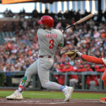 Jul 7, 2025; San Francisco, California, USA; Philadelphia Phillies first baseman Bryce Harper (3) hits a single against the San Francisco Giants during the first inning at Oracle Park. Mandatory Credit: Ed Szczepanski-Imagn Images