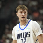 Jul 10, 2025; Las Vegas, NV, USA; Dallas Mavericks forward Cooper Flagg (32) looks on in the first quarter of the game against the Los Angeles Lakers at Thomas & Mack Center.