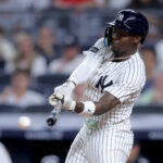 Jul 10, 2025; Bronx, New York, USA; New York Yankees second baseman Jazz Chisholm Jr. (13) hits a single against the Seattle Mariners during the eighth inning at Yankee Stadium. Mandatory Credit: Brad Penner-Imagn Images
