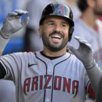 Jul 12, 2025; Anaheim, California, USA; Arizona Diamondbacks third baseman Eugenio Suarez (28) celebrates in the dugout after his second solo home run of the game during the fourth inning against the Los Angeles Angels at Angel Stadium. Mandatory Credit: Jayne Kamin-Oncea-Imagn Images