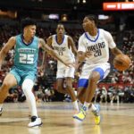 Jul 14, 2025; Las Vegas, NV, USA; Dallas Mavericks guard Zhuric Phelps (28) drives the ball against Charlotte Hornets guard KJ Simpson (25) during the first half of a NBA basketball game at the Thomas & Mack Center. Mandatory Credit: Lucas Peltier-Imagn Images