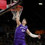 Jul 14, 2025; Las Vegas, NV, USA; Utah Jazz forward Kyle Filipowski (22) dunks the ball against the San Antonio Spurs during the first half of a NBA basketball game at the Thomas & Mack Center. Mandatory Credit: Lucas Peltier-Imagn Images