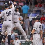 Jul 19, 2025; Atlanta, Georgia, USA; New York Yankees center fielder Trent Grisham (12) celebrates with right fielder Aaron Judge (99) after a grand slam against the Atlanta Braves in the ninth inning at Truist Park.