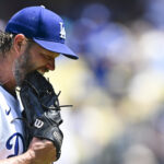 Jul 20, 2025; Los Angeles, California, USA; Los Angeles Dodgers starting pitcher Clayton Kershaw (22) reacts after being relieved from the game against the Milwaukee Brewers during the fifth inning at Dodger Stadium. Mandatory Credit: Jonathan Hui-Imagn Images