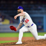Jul 21, 2025; Los Angeles, California, USA; Los Angeles Dodgers pitcher Tanner Scott (66) throws against the Minnesota Twins during the eighth inning at Dodger Stadium. Mandatory Credit: Gary A. Vasquez-Imagn Images