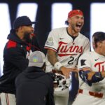 Jul 28, 2025; Minneapolis, Minnesota, USA; Minnesota Twins second baseman Brooks Lee (2) celebrates with his teammates his walk-off two run single against the Boston Red Sox in the ninth inning at Target Field. Mandatory Credit: Bruce Kluckhohn-Imagn Images