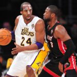 March 4, 2012; Los Angeles, CA, USA; Los Angeles Lakers shooting guard Kobe Bryant (24) controls the ball against the defense of Miami Heat shooting guard Dwyane Wade (3) during the first half at Staples Center.