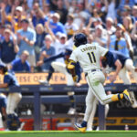Jul 9, 2025; Milwaukee, Wisconsin, USA; Milwaukee Brewers center fielder Jackson Chourio (11) hits a off-walk single during the tenth inning against the Los Angeles Dodgers at American Family Field.