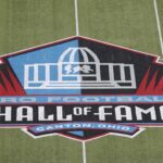 Aug 1, 2024; Canton, Ohio, USA; General view of the logo at mid-field at the Tom Benson Hall of Fame Stadium site of the Professional Football Hall of Fame game and Class of 2024 induction ceremonies.