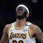 Mar 16, 2025; Los Angeles, California, USA; Los Angeles Lakers guard Jordan Goodwin (30) wears a protective face mask against the Phoenix Suns in the second half at Crypto.com Arena.