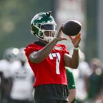 Jul 25, 2025; Florham Park, NJ, USA; New York Jets quarterback Justin Fields (7) catches a ball during a drill at training camp at Atlantic Health Jets Training Center.