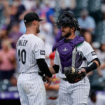Jul 23, 2025; Denver, Colorado, USA; Colorado Rockies relief pitcher Tyler Kinley (40) celebrates with catcher Austin Nola (20) after the game against the St. Louis Cardinals at Coors Field.