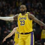 Feb 20, 2025; Portland, Oregon, USA; Los Angeles Lakers forward LeBron James (23) signals to teammates during the second half against the Portland Trail Blazers at Moda Center.