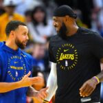 Dec 25, 2024; San Francisco, California, USA; Golden State Warriors guard Stephen Curry (left) and Los Angeles Lakers forward LeBron James (right) talk before the game at Chase Center.