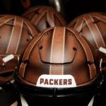 The Green Bay Packers will wear uniforms during one game this season based on their 1923 uniforms, including modern helmets hand painted to resemble leather helmets of the time. Fan versions of the helmets, shown on July 24, 2025, at the Packers Pro Shop in Green Bay, Wis, retail for $1,600 each.