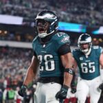 Jan 26, 2025; Philadelphia, PA, USA; Philadelphia Eagles running back Saquon Barkley (26) celebrates after a touchdown against the Washington Commanders during the second half in the NFC Championship game at Lincoln Financial Field.