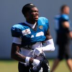 Jacksonville Jaguars wide receiver Travis Hunter (12) smiles as he walks off the field after an NFL training camp session at the Miller Electric Center, Tuesday, July 29, 2025, in Jacksonville, Fla.