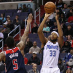 Orlando Magic Adreian Payne Dec 23, 2017; Washington, DC, USA; Orlando Magic forward Adreian Payne (33) shoots the ball over Washington Wizards forward Markieff Morris (5) in the first quarter at Capital One Arena. Mandatory Credit: Geoff Burke-USA TODAY Sports