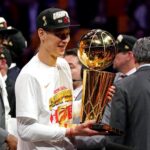 Jun 13, 2019; Oakland, CA, USA; Toronto Raptors guard Jeremy Lin (17) celebrates with the Larry O'Brian Trophy after beating the Golden State Warriors in game six of the 2019 NBA Finals at Oracle Arena.