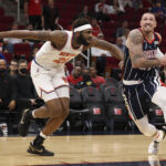 Dec 16, 2021; Houston, Texas, USA; Houston Rockets center Daniel Theis (27) dribbles against New York Knicks center Mitchell Robinson (23) in the first quarter at Toyota Center.