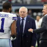 Jan 16, 2022; Arlington, Texas, USA; Dallas Cowboys outside linebacker Micah Parsons (11) meets with owner Jerry Jones (center) and NFL commissioner Roger Goodell (right) prior to the NFC Wild Card playoff football game against the San Francisco 49ers at AT&T Stadium.