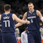 Jan 17, 2022; Dallas, Texas, USA; Dallas Mavericks guard Luka Doncic (77) celebrates with center Kristaps Porzingis (6) during the second half against the Oklahoma City Thunder at American Airlines Center.